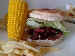 Turkey Burger in Blackberry Sauce served with Sweet Corn and Fries.