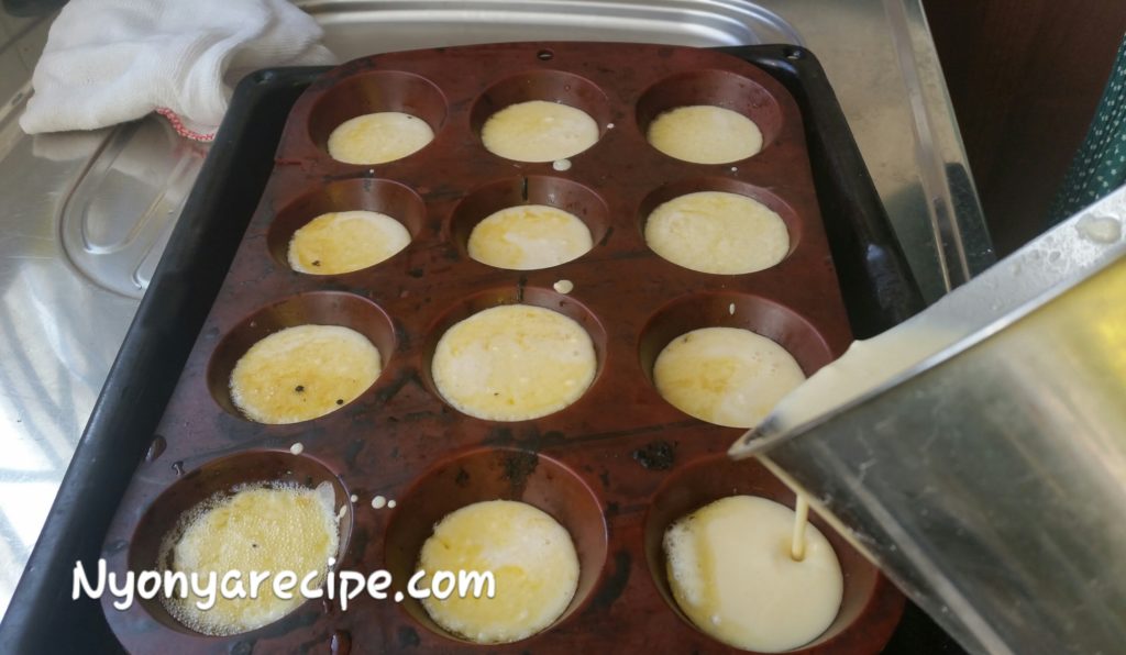 Pouring the batter into the muffin tin. Notice the bubbling at the side.