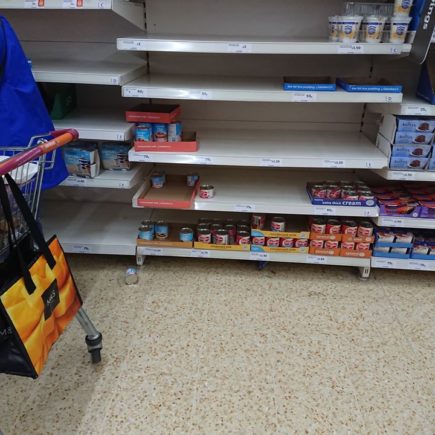 empty shelf in a super-market. No flour or essential food.