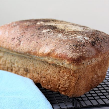 Freshly baked bread cooling on a rack.