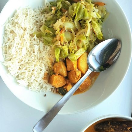 Nyonya Curry Bowl with rice and cabbage.